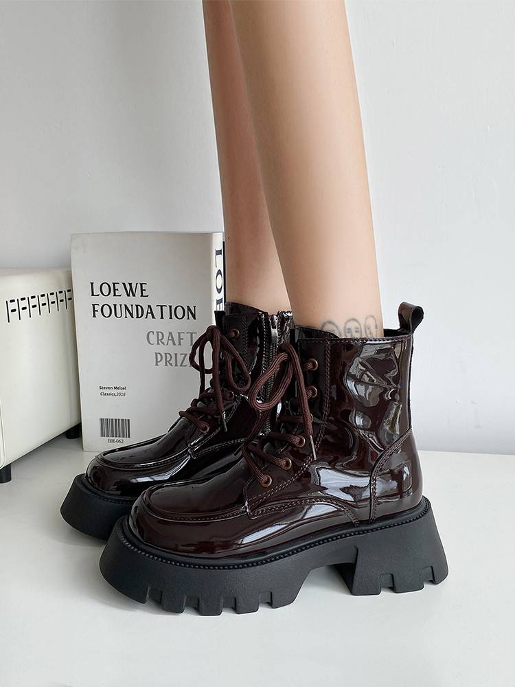Black Martin Boots in the fall of winter 2023 with short boots on the bottom of the zipper