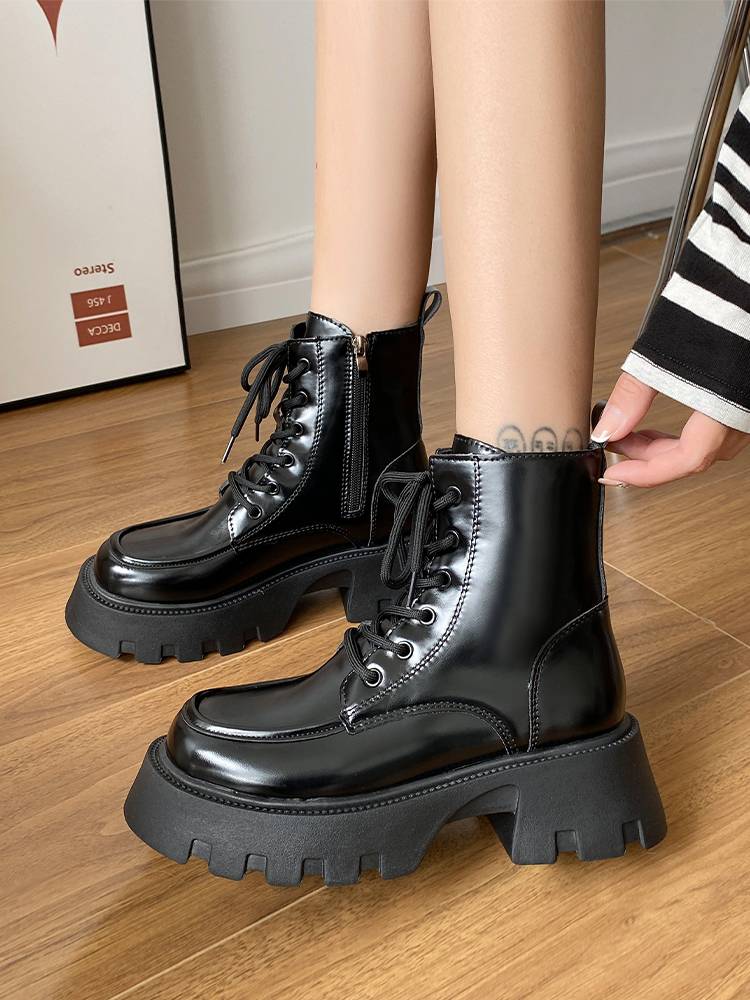 Black Martin Boots in the fall of winter 2023 with short boots on the bottom of the zipper