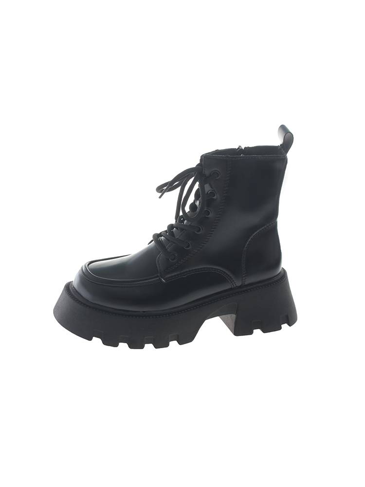 Black Martin Boots in the fall of winter 2023 with short boots on the bottom of the zipper