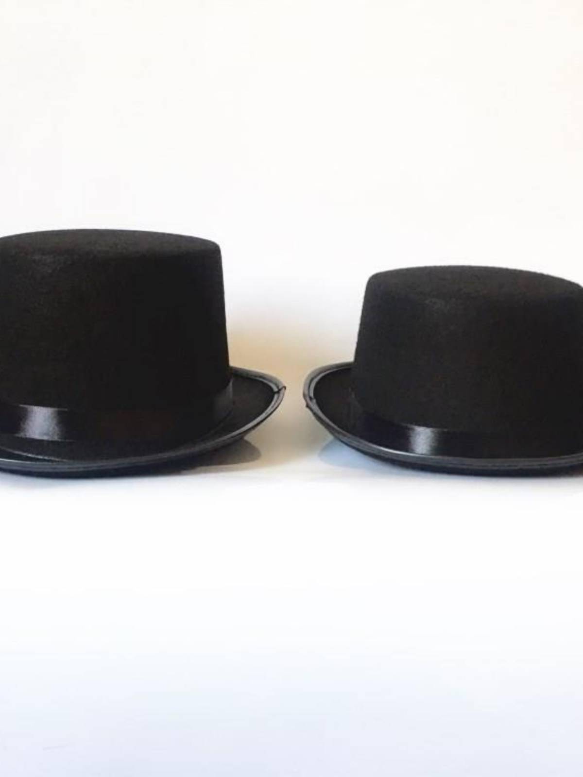 The magic man's hat, Lincoln's hat, black hat, and a 6-1-year-old kid dressed for Christmas