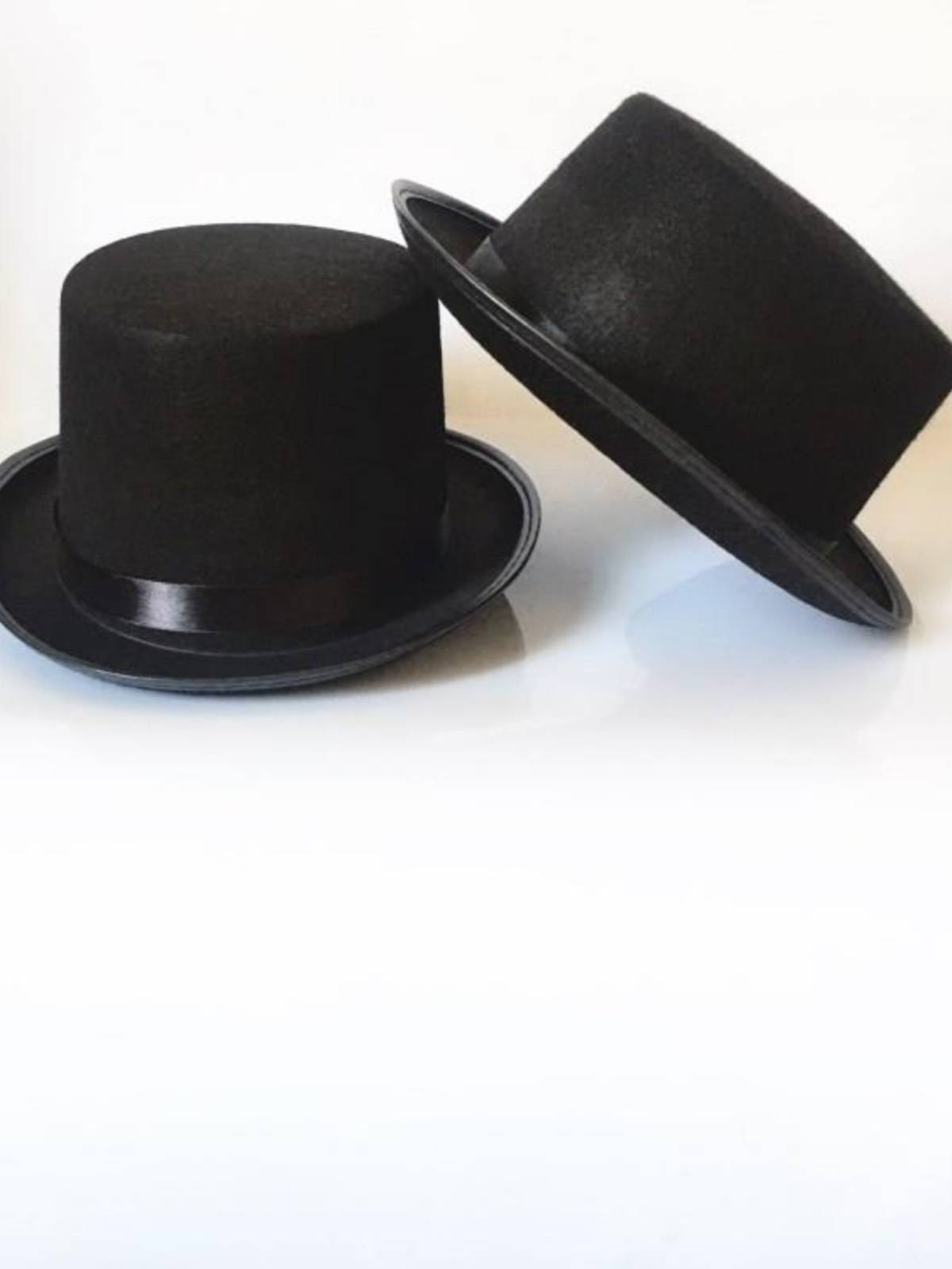 The magic man's hat, Lincoln's hat, black hat, and a 6-1-year-old kid dressed for Christmas