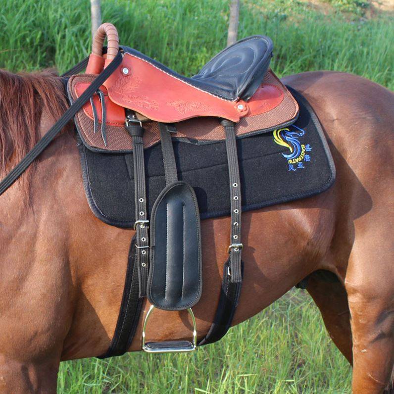 An orange red saddle with a full set