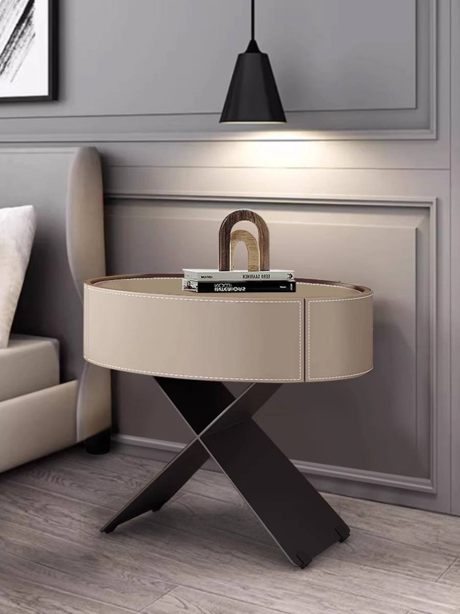 Italian minimalist horse saddling bedside cabinet modern bedroom Creative oval bedside storage cabinet light luxury high -level sensor side cabinet