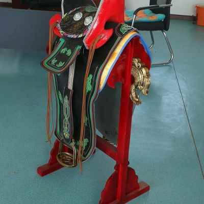 High-quality Mongolian-made saddles full of new horses with ox-skins