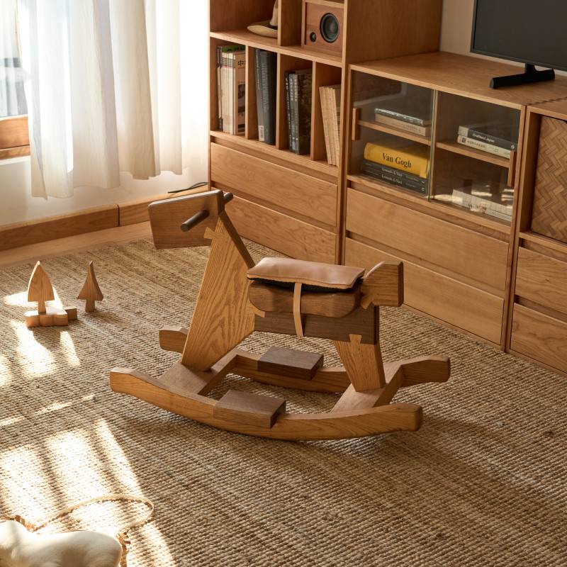 A big wooden horse and saddle
