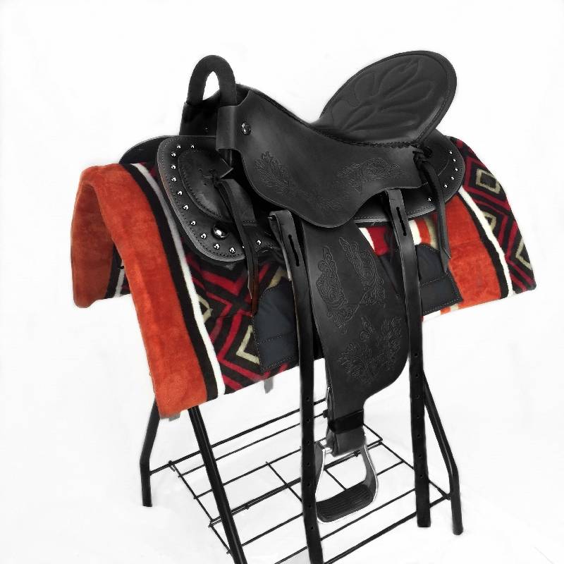 A saddled saddled up on the ground, a saddled saddled saddled up with a folded saddled horse