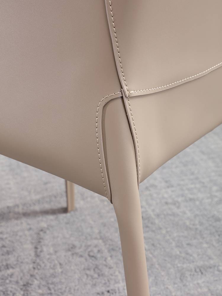 The dining chair is intended to be a very simple, very expensive Nordic saddle chair