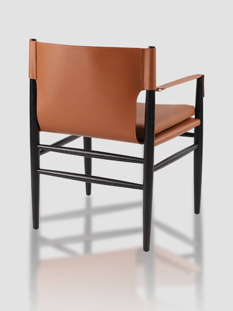 Nordic light luxury designer dining chair high -level sense of silence, minimalist, high -end black walnut solid wood saddle chair