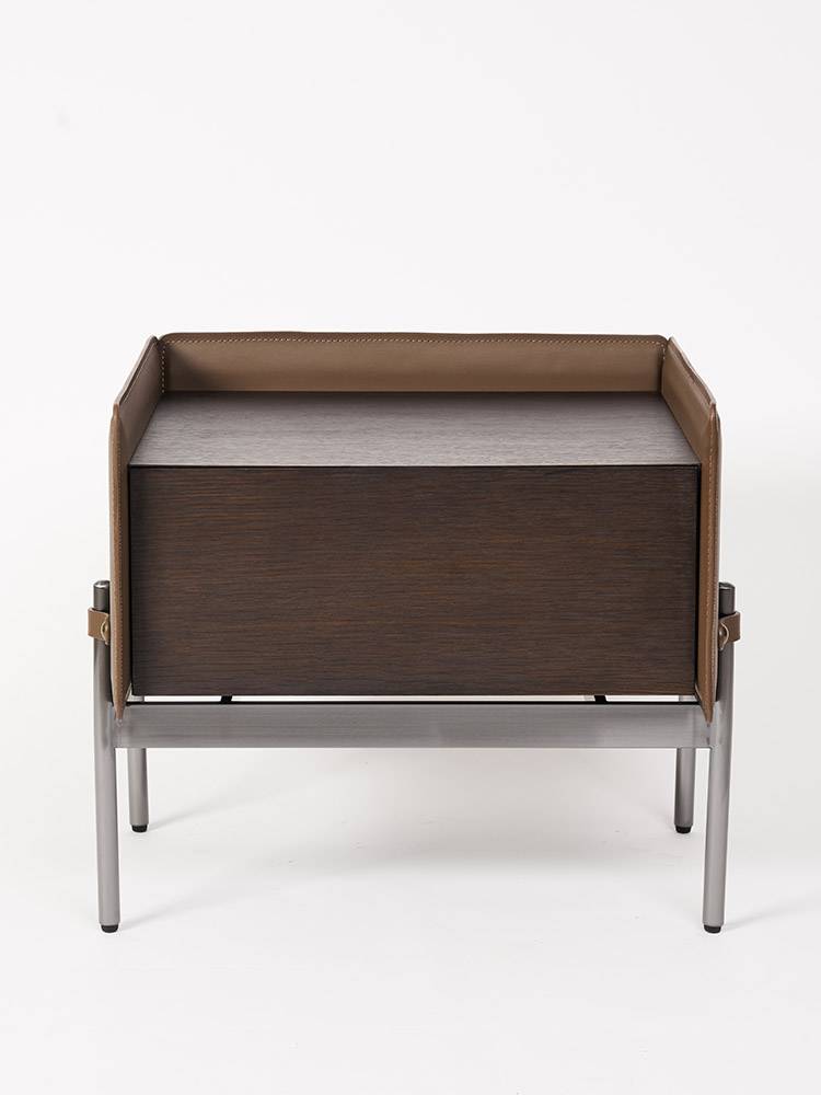 Aston Martin's very simple saddle-covered, modern, simple bedside cabinet for the master designer