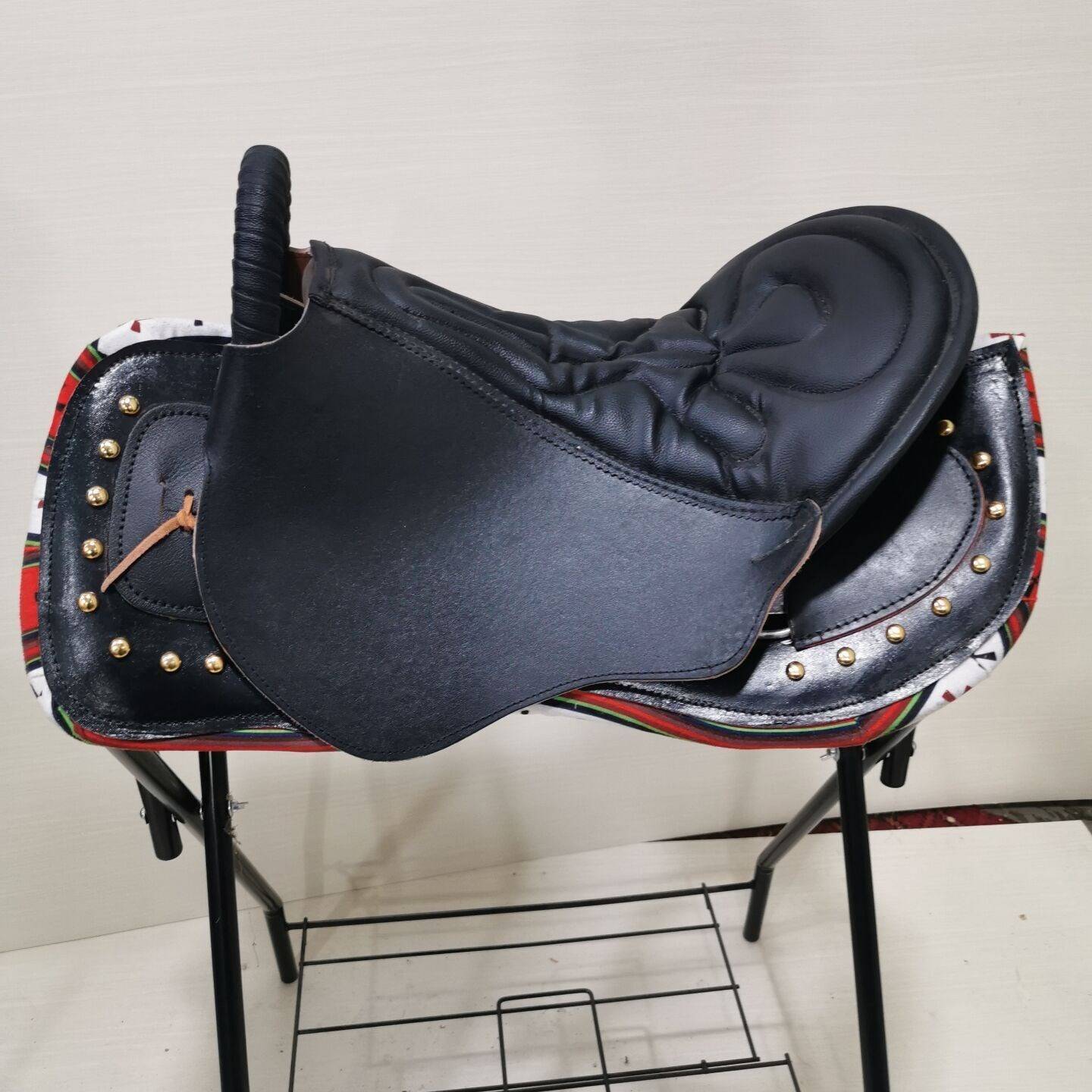 Black, tan and bare saddle