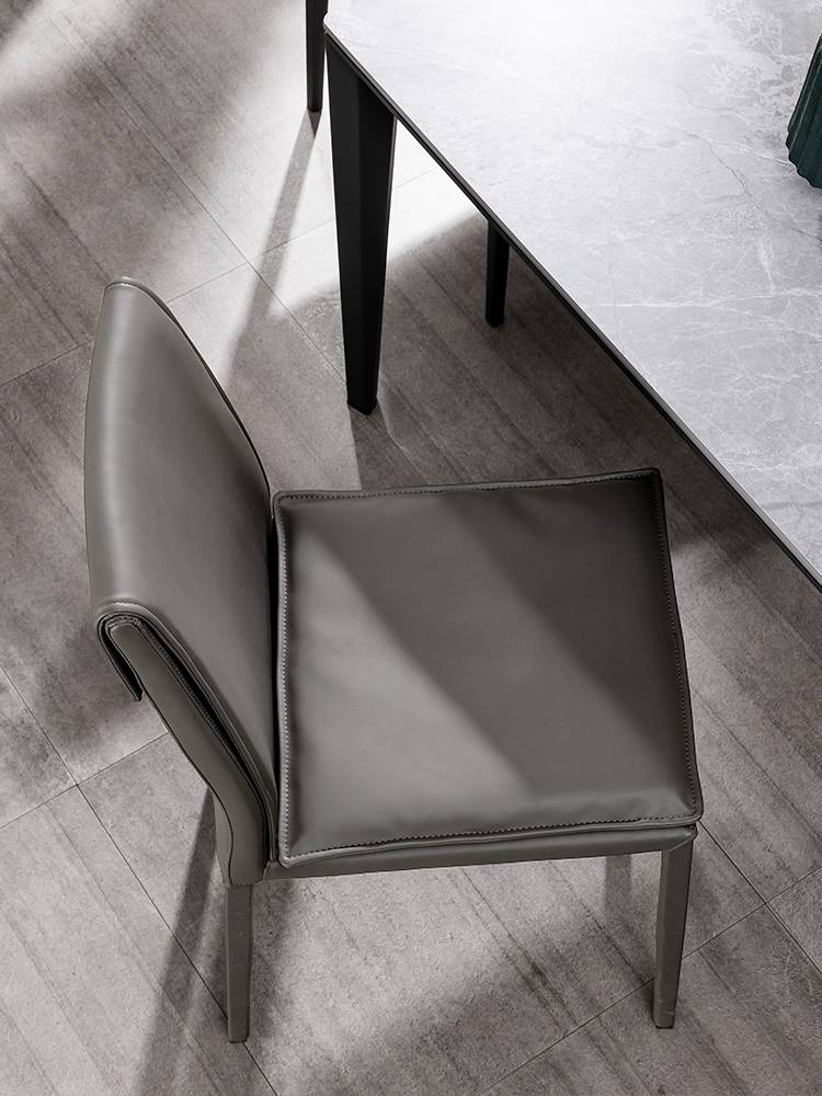 Italian minimalist modern dining chair saddling leather chair Nordic minimalist restaurant chair light luxury home leather dining chair designer