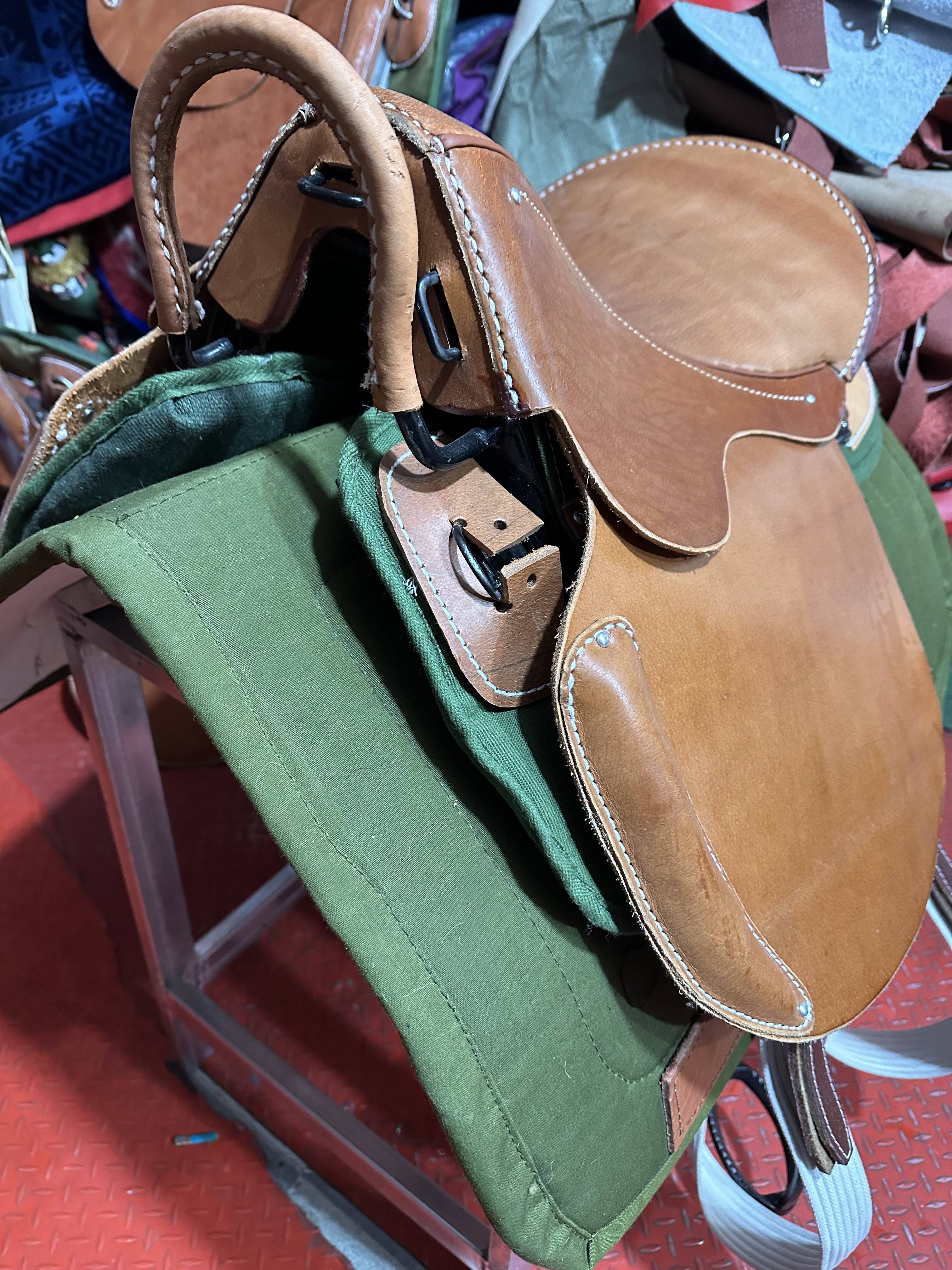 All of the cow-skin parts of the horse's horse's graft are sorely screeched with old army saddles