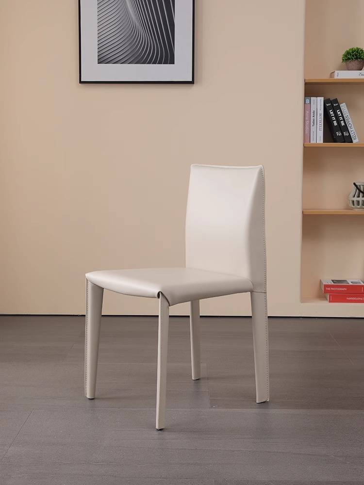 A saddle-skin-stool home with a back-seat red bench at the hotel restaurant table with a simple designer chair