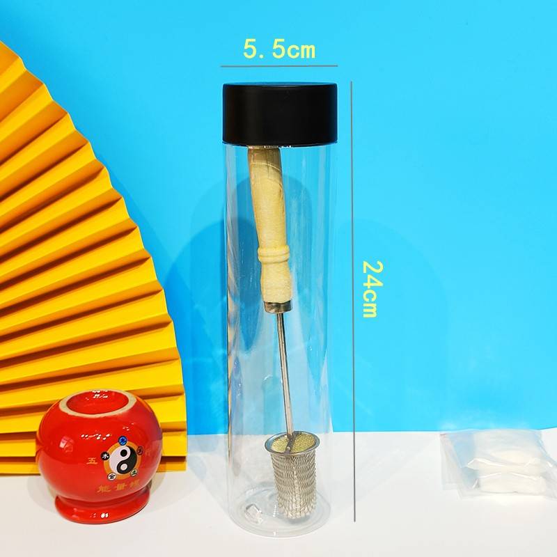 A fire rod and a glass of alcohol