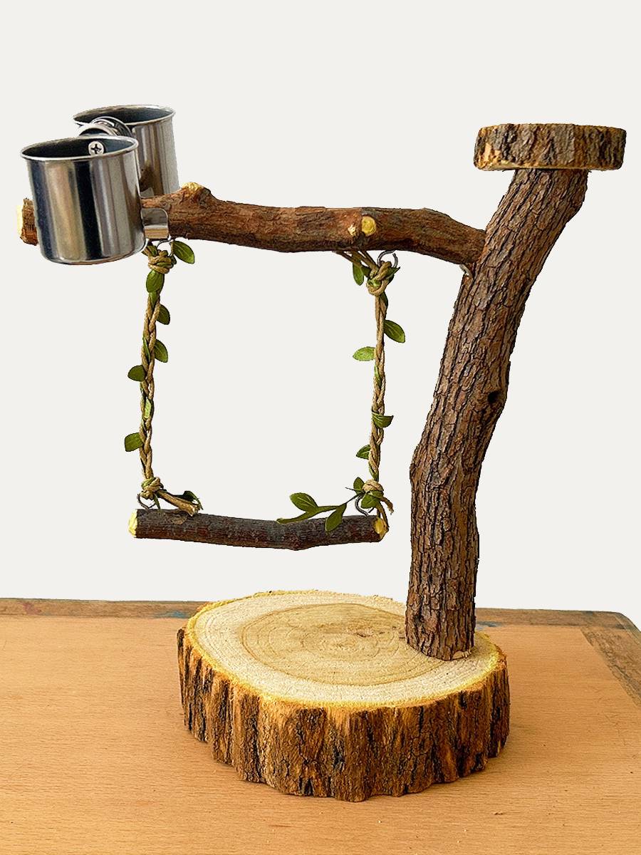 A bird station with a real tree and a parrot with a bird's troupe