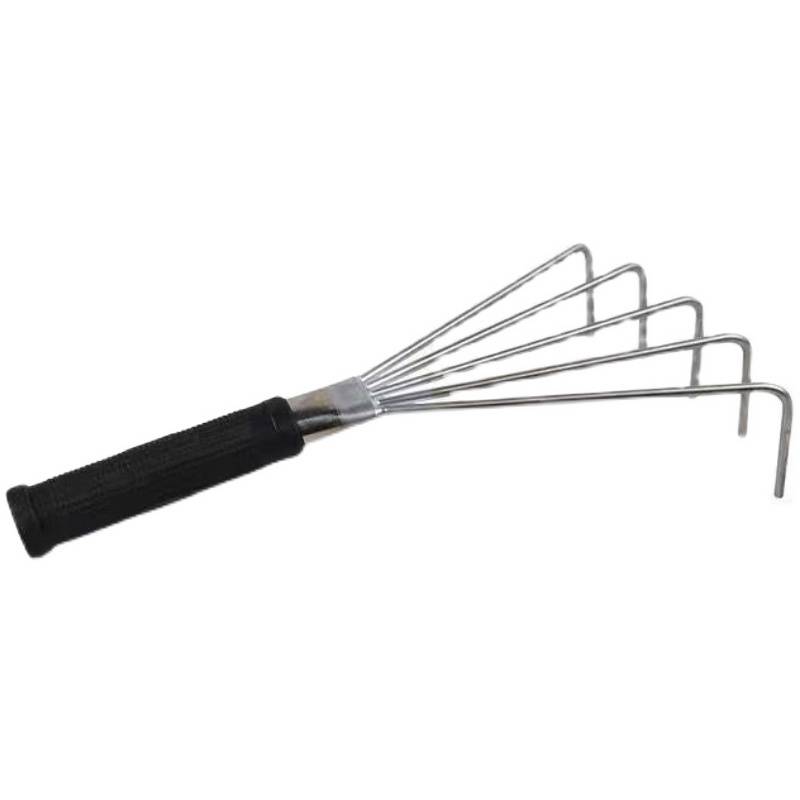 A hand-made stainless steel rake tool for a small tile-plated rickshawer