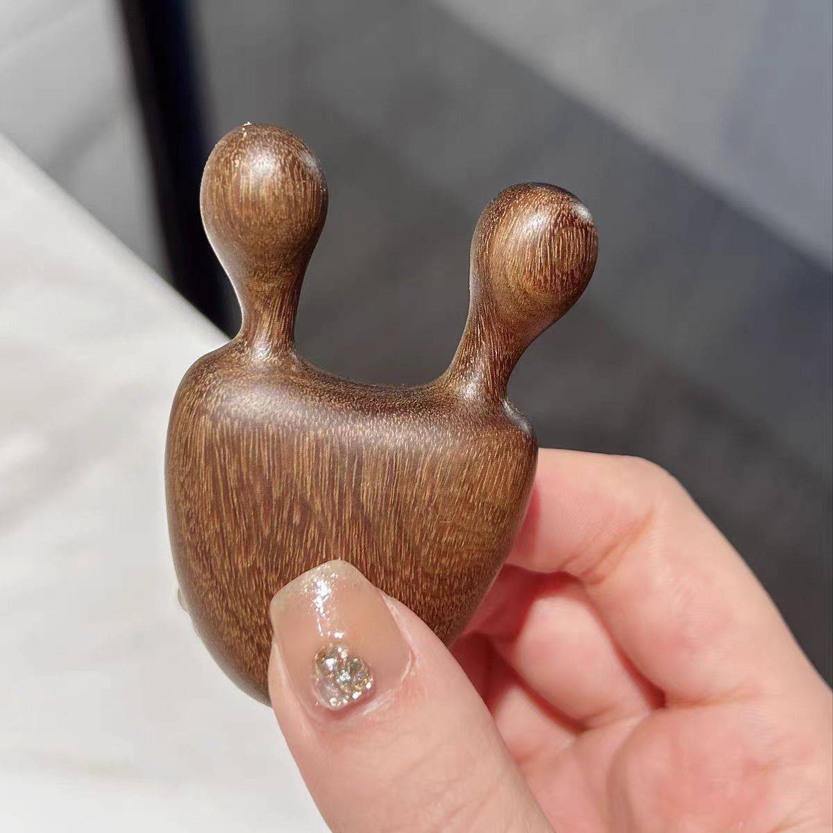 A multi-purpose beauty massage stick