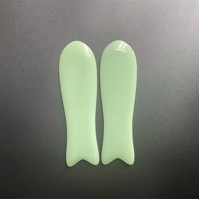 Two pairs of green and orange fish