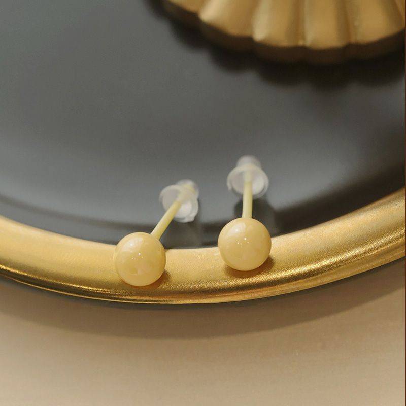 Ceramic ear nails. Yellow pair
