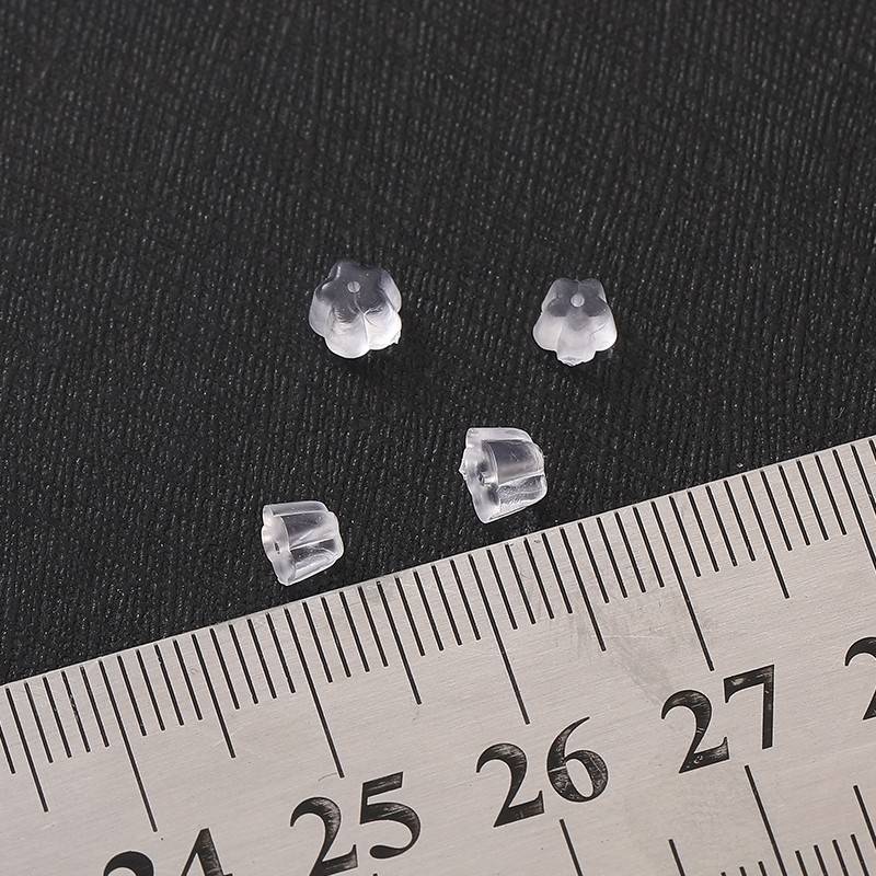 Silicone plum blossom ear blocked universal high -grade anti -skids and ear earns blocked earrings. Ear fake at earlier 2023 Ear