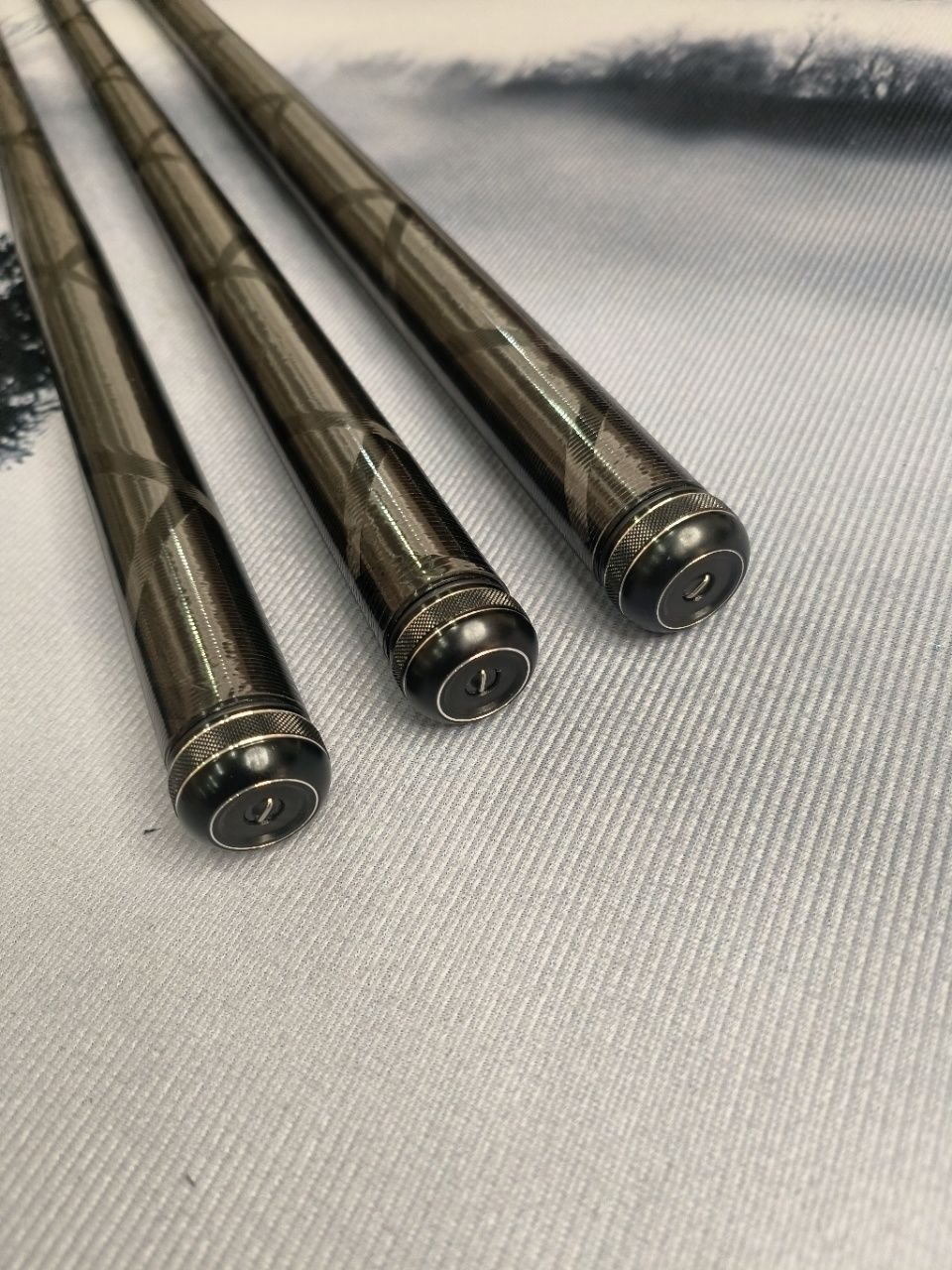a 19-to-5-h black pit rod, a carp pole and a carbon pole