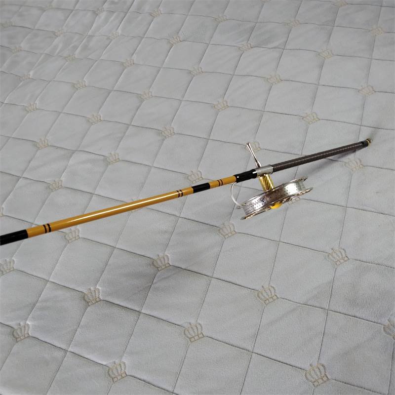 A porcelain conductor full of three-and-a-half-metre super-thirty-seven-moder carbon-condensed fishing pole