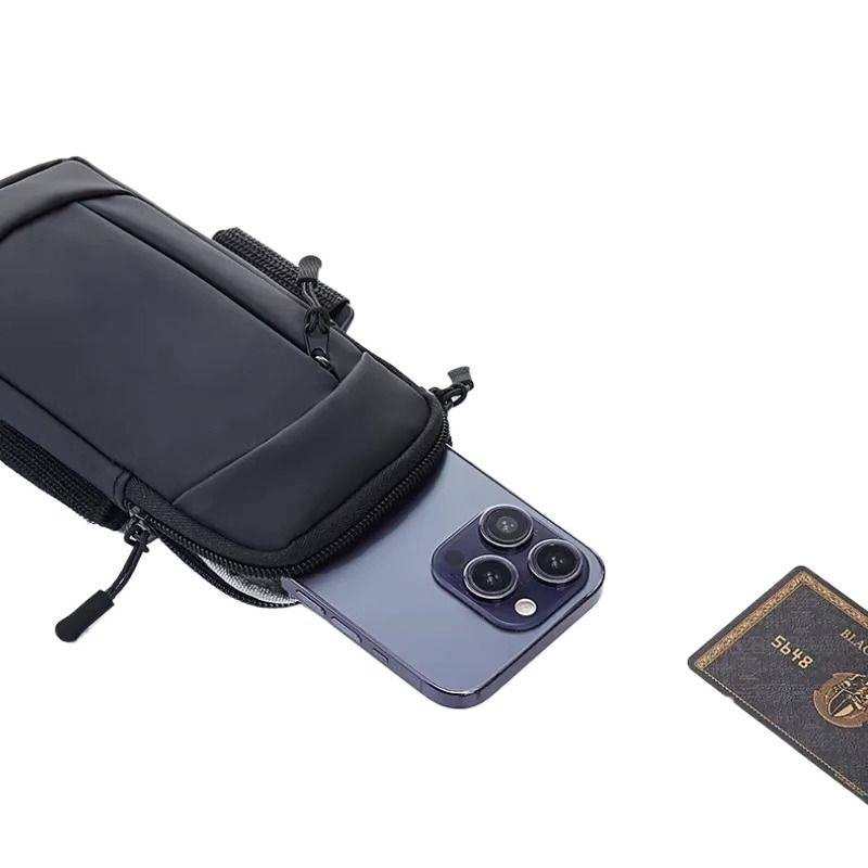 A running mobile phone bag and arm for gym equipment with a light-stringed sports arm set on his wrist