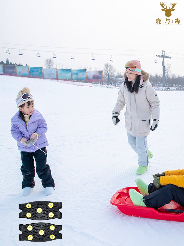 Outdoor shoes with simple ice-clawed shoes nailed to an old man's snow-clawed child against a winter skating machine