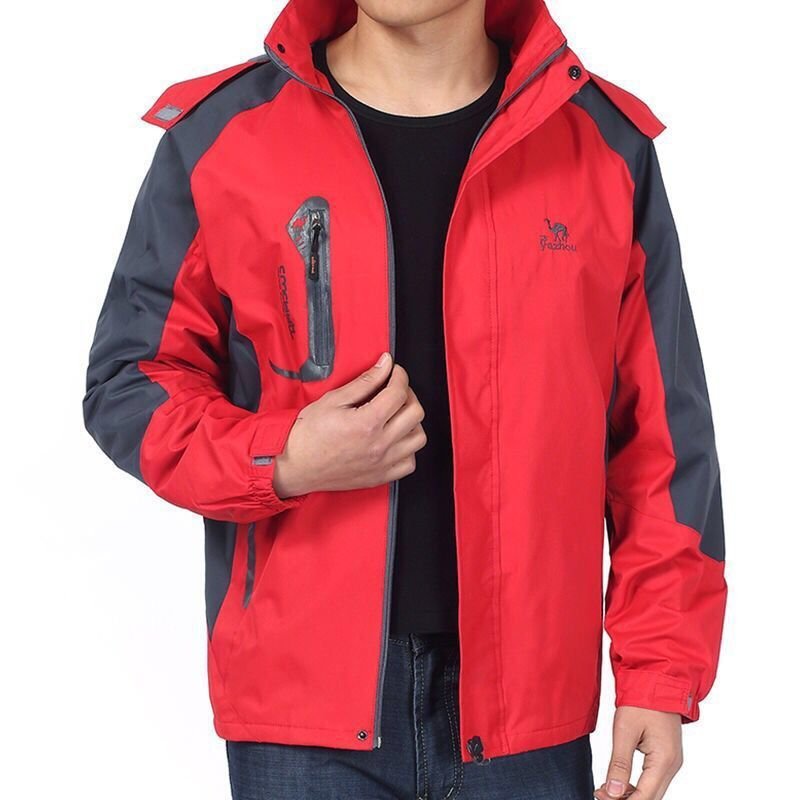 A man in an exterior assault suit, a wind-proof jacket-dresser with a grinding-work suit to climb a mountain coat