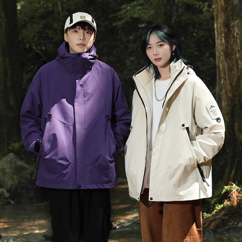 Three times a man and a woman in an outdoor assault suit can take off a warm winter and wind and mountain warmer
