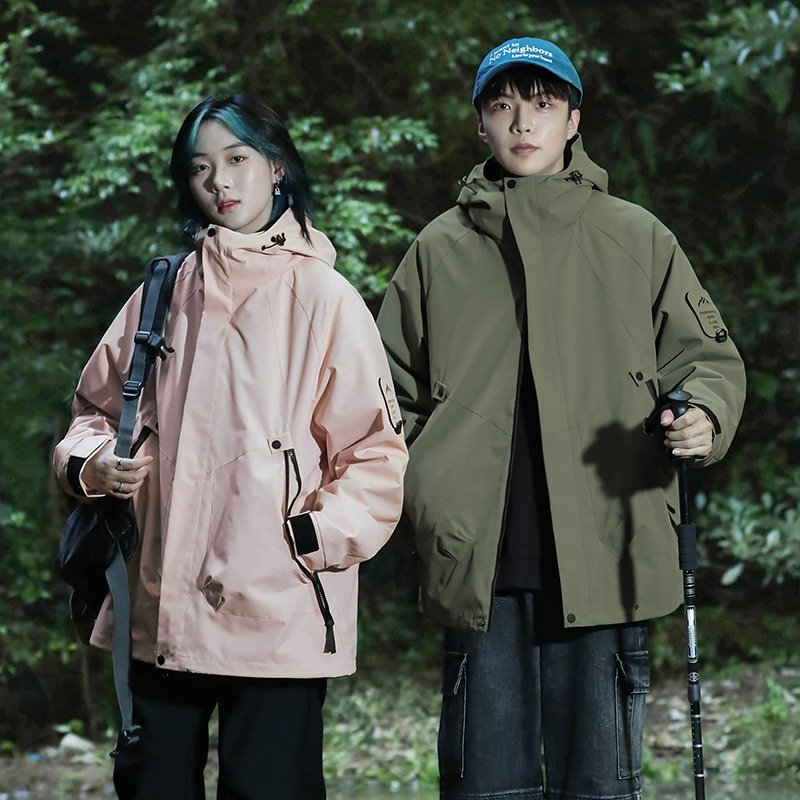 Three times a man and a woman in an outdoor assault suit can take off a warm winter and wind and mountain warmer