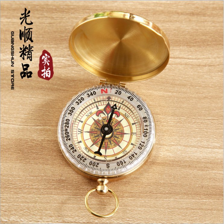 An outdoor compass for a child with a high-precision sports climber pointed the nightlight to the north needle