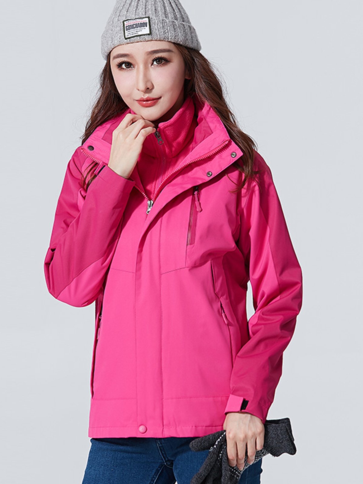 A man and a woman in an assault suit can take off a velvet, windproof and waterproof jacket and climb out the mountain in winter