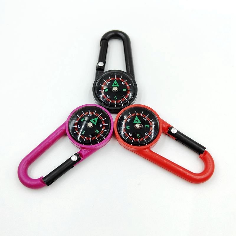 Portable liquid suspension pointer of an outdoor mountain landing compass linked to a multifunctional fast-track compass