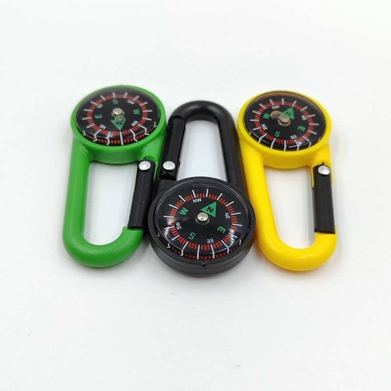 Portable liquid suspension pointer of an outdoor mountain landing compass linked to a multifunctional fast-track compass