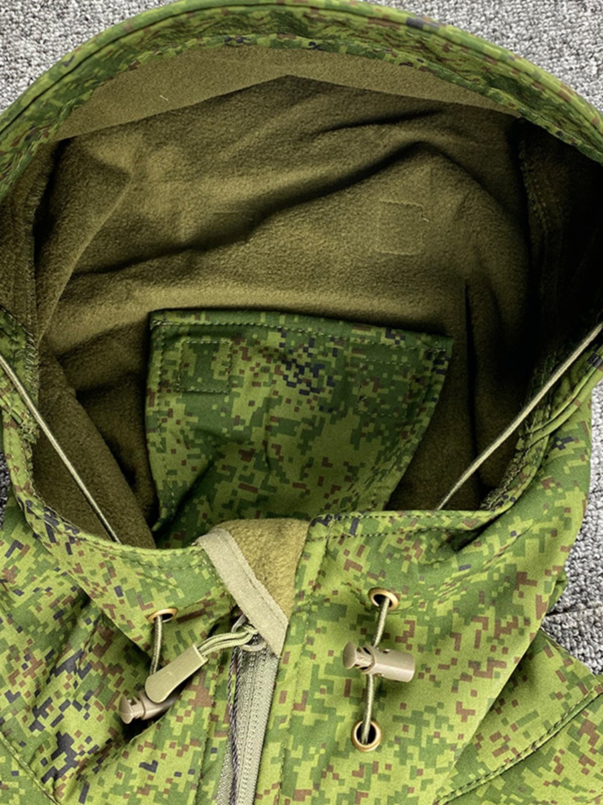 THE RUSSIAN-OWNED EMR CAMOUFLAGE SUIT, THE LITTLE GREEN MAN'S SOFT-SHELL-SKINNED OUTSIDE, HEATED AND WATERPROOF