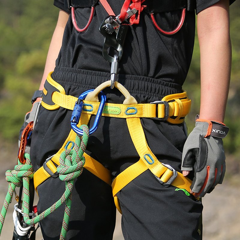Hindawa is wearing a safety belt outside of the house
