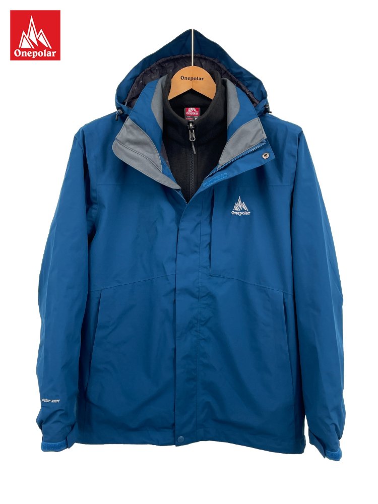 A man and a woman with a water- and anti-fouling suit and a man with a coat to board the mountain