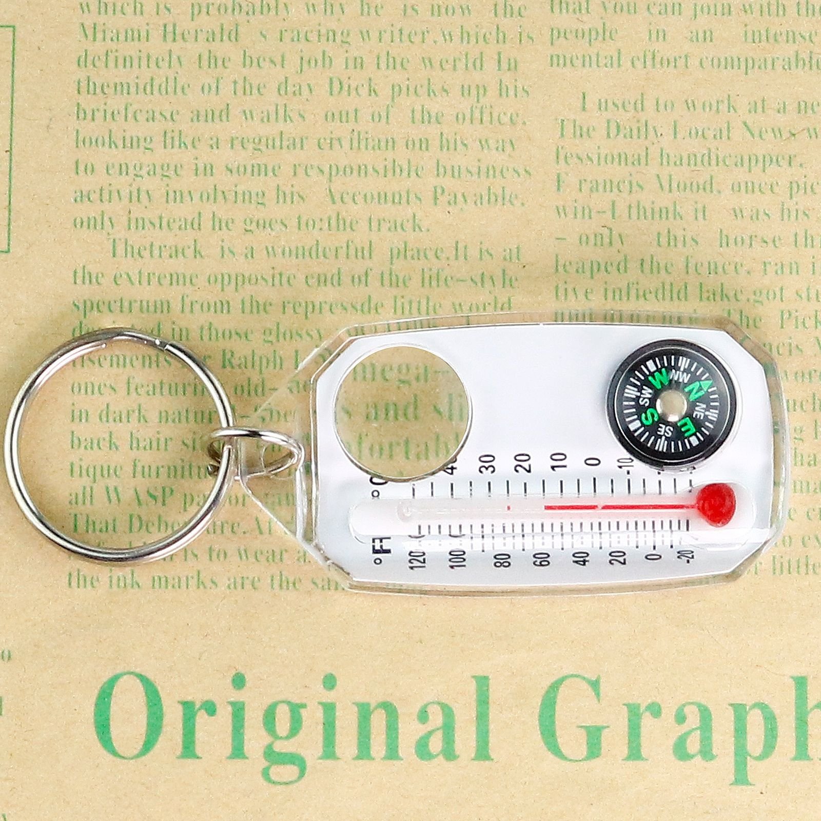 A three-in-one compass with a high-precision multi-functional mini-portable side thermometer magnifier key button