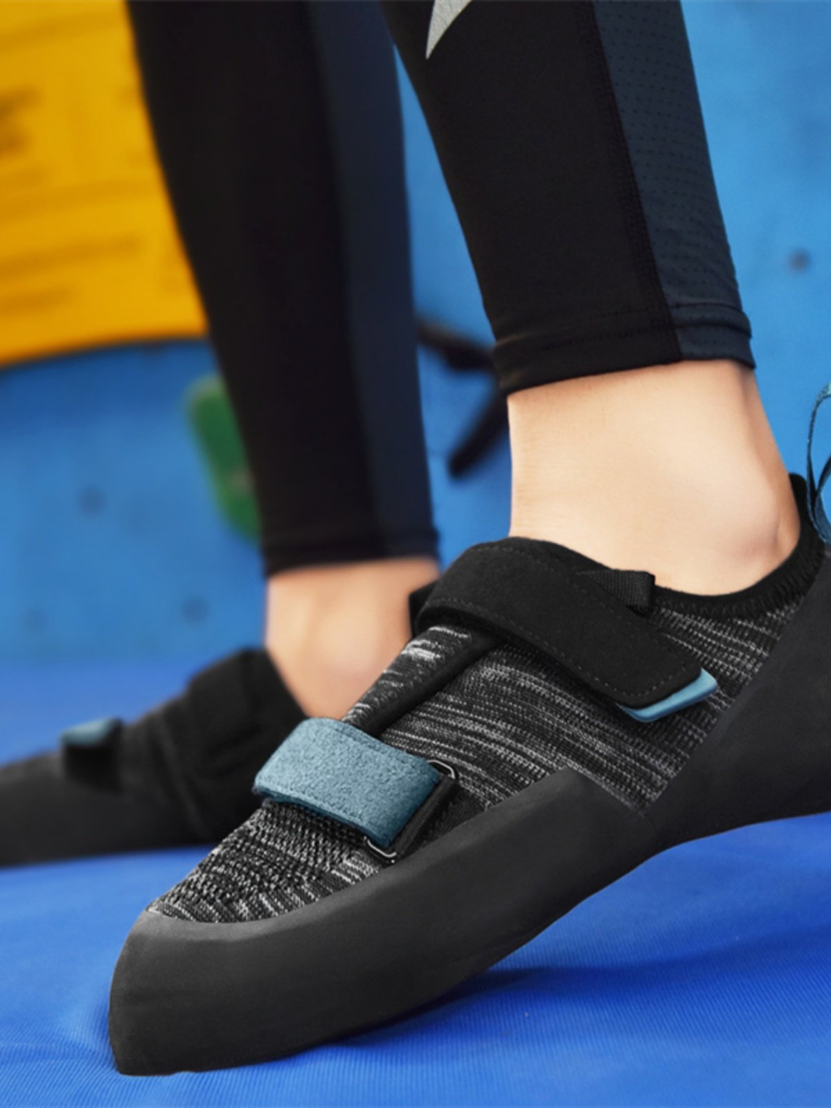 The man and woman in the rock-climbing shoes are trained to climb rock in the field