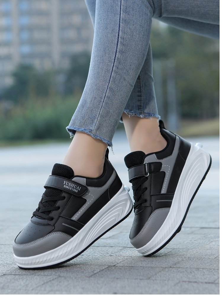 A girl with a wheeled shoe with a four-wheeled deformation shoe