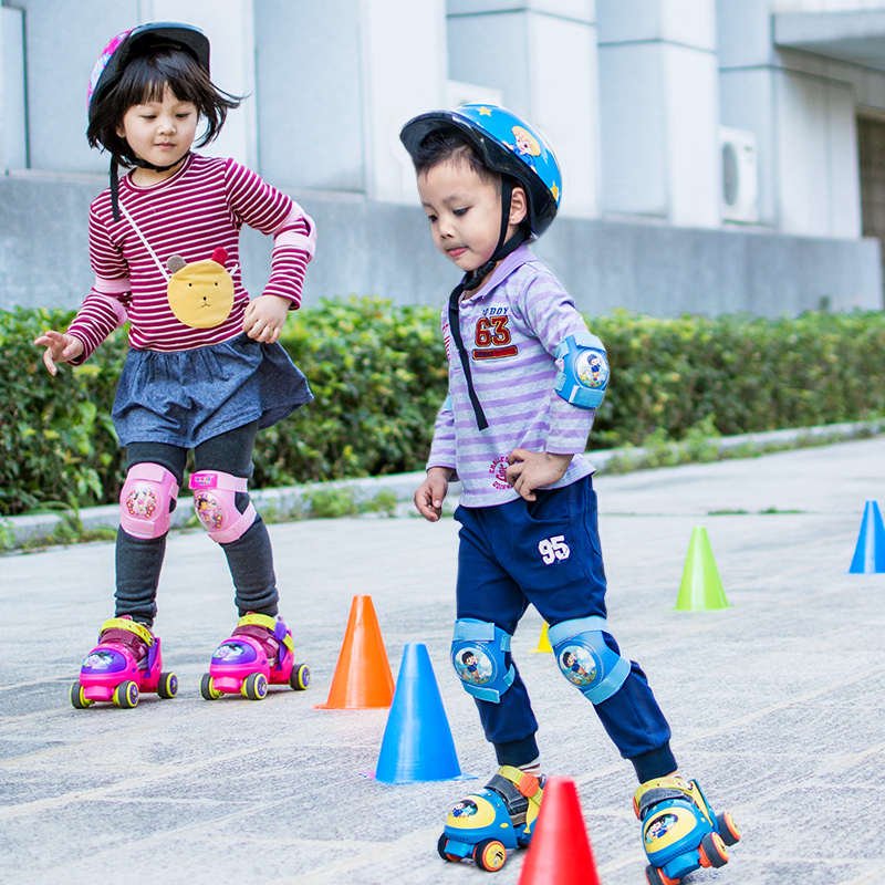 A young boy with two skates and a baby with four-wheeled roller skates and a three-year-old boy with a first-rate scholar