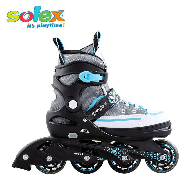 Children's skater boys lined up straight to a roller skater