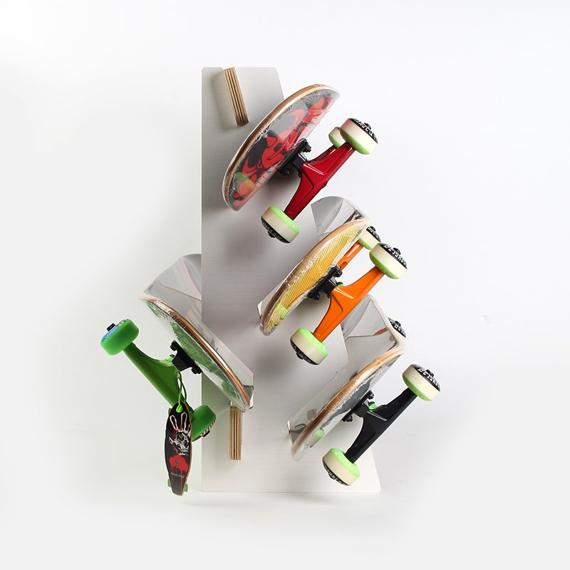 Two-barrel skateboards, long-boarded electric skateboards, re-mounted on multiple-layered, wood-carved wall hanger
