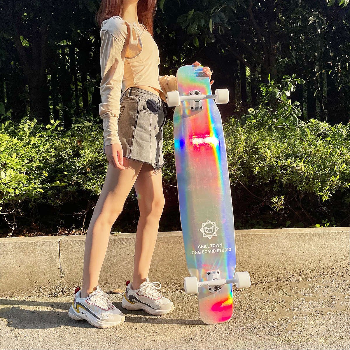 Chelltown, a caramel long-board skating professional, male and female beginners brushing the streets and walking the kids