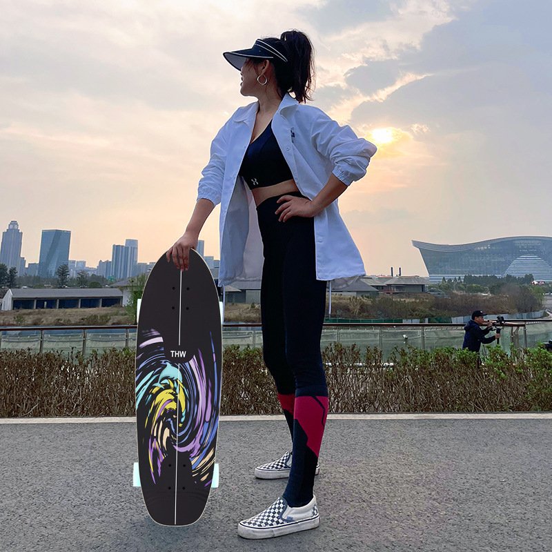 Land surfboard children's beginners, adults, four-wheeled skateboards on the street