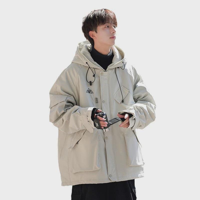 A man and a man with a nice couple skiing suit, a waterproof port, a pocket full of bags, a big warm jacket