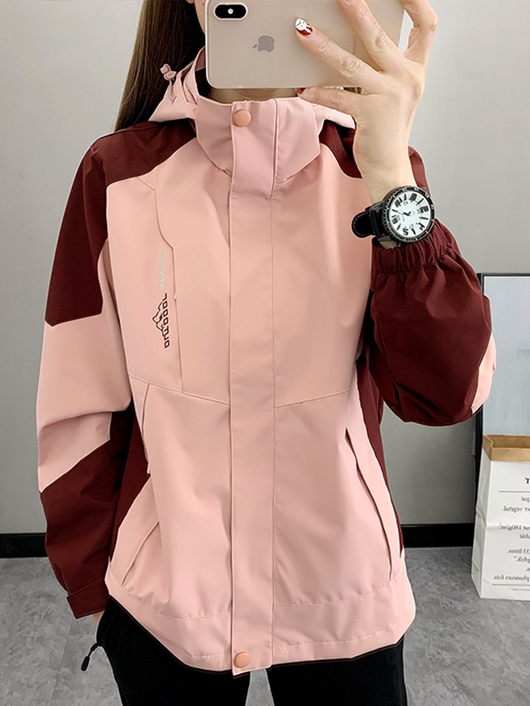 The three-in-one woman in a Phil's T-shirt can take off two pairs of velvet jackets