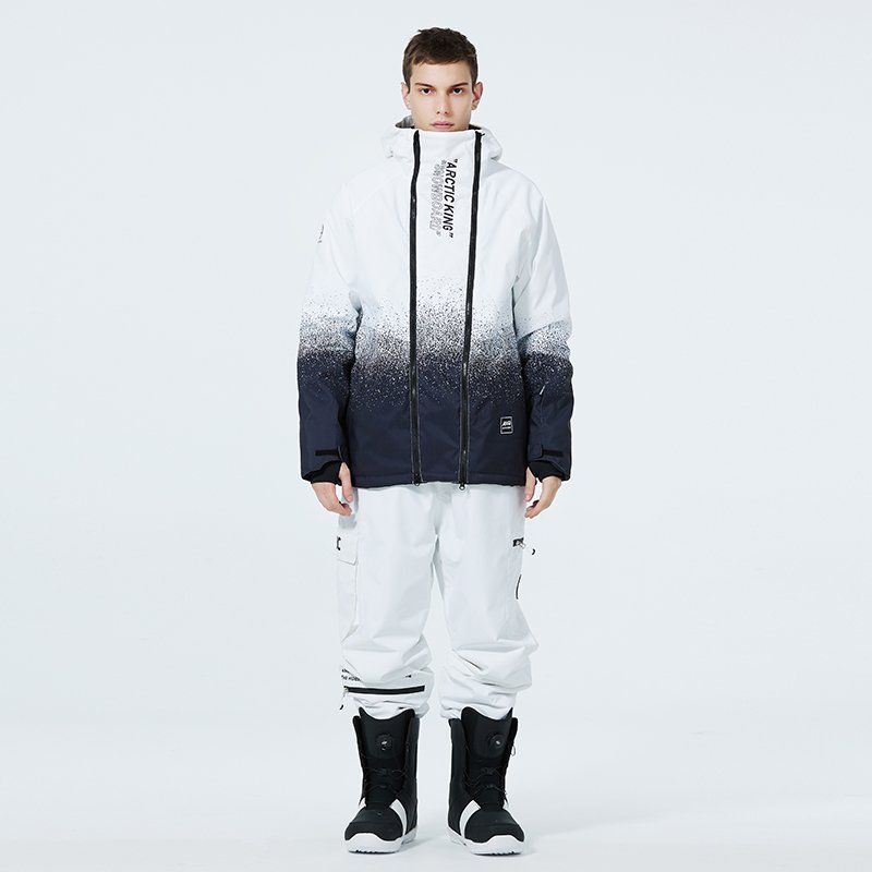 A woman in ski suit with a man in an outdoor winter weather and waterproof and thick ski pants