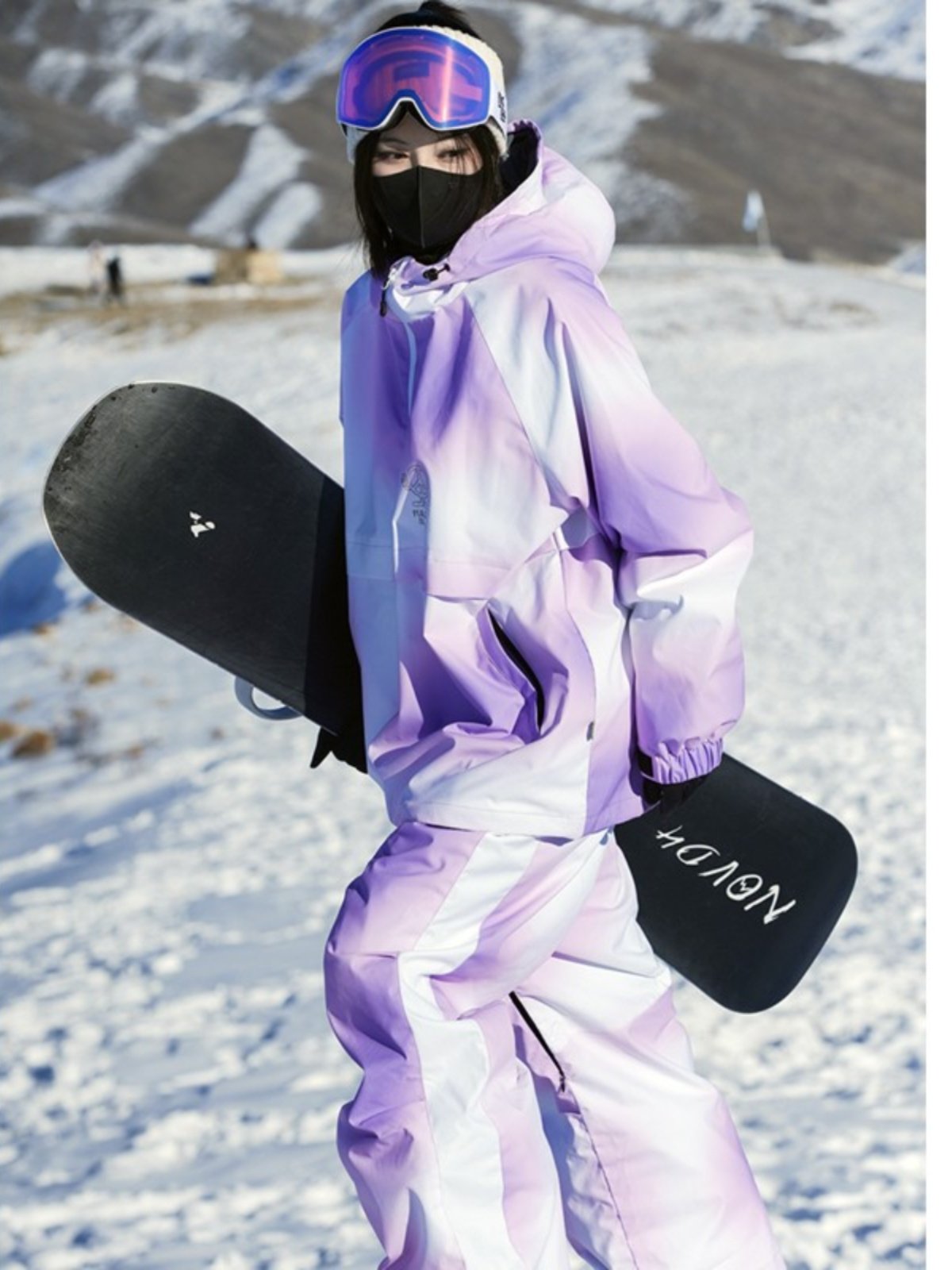 new united states of america-supplied snow-slipsuit for a girl with a purple suit for water and wind protection